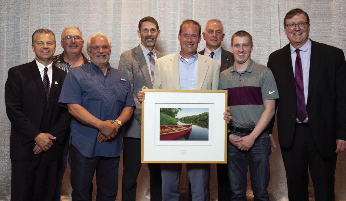 City of St Michael Administrator/City Engineer Steve Bot was presented with the League of Minnesota Cities (LMC) 2019 James F. Miller Leadership Award on On June 27,. Pictured from left are LMC Executive Director Dave Unmacht, former St. Michael Councilor Joe Marx, former St. Michael Mayor Jerry Zachman, St. Michael City Councilor Keith Wettschrenk, Bot, St. Michael Mayor Kevin Kasel, St. Michael City Councilor Ryan Gleason, and LMC President Mike Mornson. 