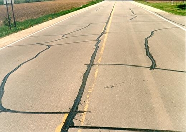 Rural road with sealed cracks