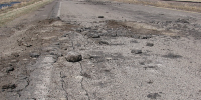 Photo of worn paved road